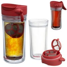 two cups with lids, one filled with liquid and the other containing an object in it