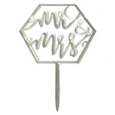 a white cake topper with the words mr and mrs in cursive writing