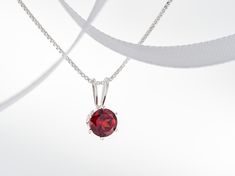 January Red, Mozambique Garnet Necklace. Round, 5mm, Gemstone in a 6-Prong, Sterling Silver Pendant. Great value! Chain Options. #SterlingSilver #mozambique #SilverPendantChain #RoundFaceted #BirthstoneNecklace #GarnetNecklace #RedGarnet #NaturalGarnet #JanuaryPendant #RedPendant Elegant Red Birthstone Necklace For Gift, Elegant Red Birthstone Necklace Gift, Round Garnet Gemstone Necklaces, Red Round Pendant Birthstone Necklace In Fine Jewelry Style, Red Round Pendant Birthstone Necklace, Red Round Pendant Birthstone Necklace For Formal Occasions, Red Round Stone Necklaces For Anniversary, Garnet Birthstone Round Necklace, Classic Garnet Birthstone Necklace