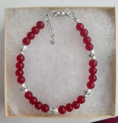 Red Round Bead Bracelet , Swarovski,Christmas Bracelet, Red Glass Beads ,Glass Bead Bracelet, Glass Bead Bracelet, Silver Rhinestone Spacers Approximately 7 inches, make sure this will fit your wrist. Beads used are 4mm and 6 mm in diameter  All my bracelets are handmade. Please note -  I do my very best to give you accurate measurements and descriptions All my jewelry is delivered in a gift box and beautiful organza gift bag, perfect for keeping your jewelry safe, or ready to give if it is a gift! No refunds or exchanges * see more brackets at https://decowrist.etsy.com/ Red Gemstone Beads Crystal Bracelet Gift, Elegant Red Crystal Bracelet With 8mm Beads, Elegant Red Crystal Bracelet With Gemstone Beads, Elegant Beaded Bracelets As Christmas Gifts, Elegant Beaded Bracelets For Christmas Gift, Elegant Beaded Bracelets For Christmas, Red Rondelle Gemstone Beaded Bracelets, Gift Pearl Bracelet With Faceted Rondelle Beads, Elegant Adjustable Beaded Bracelets For Christmas