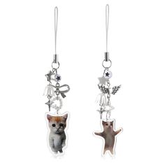 two earrings with cats and stars hanging from them