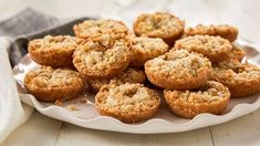 a white plate filled with muffins on top of a table