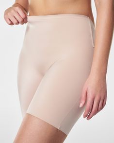 A low-profile shaping short designed to prevent visible panty lines and inner thigh chafing. In a sleek fabric that delivers firm support to your front—with a low back that stays invisible under your most scene-stealing styles. Featuring a stay-put silicone strip at the waistband that won't roll. | Spanx Women's Suit Your Fancy Shaping Low Back Mid-Thigh Shorts Inner Thigh Chafing, Thigh Chafing, Backless Dresses, Mid Thigh Shorts, Special Occasion Outfits, Designer Shorts, Free Fabric, Low Back, Shapewear