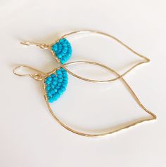 14k gold filled Organic flowing lotus shape hoop and faceted turquoise rondelle beads. These elegant hoop are super light and comfortable to wear. Lotus hoop were hand forged and textured for extra shine using 14k gold filled wire. 14k gold filled handmade french ear wires. Lotus hoop are about 1.5 x 2 inches in size. Turquoise is the birthstone for December. Turquoise is a beautiful stone that appears in a stream of heavenly colours - from aqua blue to light azure green. It has a pure and uplif Adjustable Teardrop 14k Gold-filled Hoop Earrings, Turquoise 14k Gold Filled Earrings, Yoga Earrings, Lotus Shape, Turquoise Hoop Earrings, Turquoise Hoops, Hawaiian Jewelry, Birthstone Earring, Hand Crafted Gifts