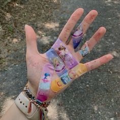 a person's hand with different designs on it