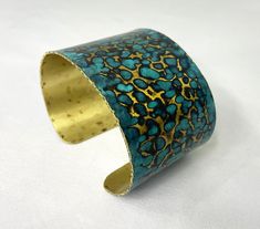 These unique, hand-formed copper and brass cuff bracelets with vibrant patinas create stunning accents to your personal style. Dress up or down- either way you'll be wearing an adornment that will turn heads, start conversations, and delight the eye of the beholder. Hammered Brass cuff with a beautiful bright blue cupric nitrate patina. Please note that patina colors will look different depending on the screen/device you view them on. This is a medium size cuff, see measurements below. Cuffs hav Handmade Turquoise Metal Cuff Bracelet, Artisan Bronze Cuff Bangle Bracelet, Adjustable Blue Cuff Bracelet With Patina, Adjustable Gold Cuff Bracelet With Patina, Adjustable Blue Patina Cuff Bracelet, Unique Handmade Bronze Bangle, Patina Brass Bangle Bracelet, Handmade Brass Cuff Bracelet Wearable Art, Brass Bangle Bracelet With Patina