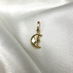 14K Yellow Gold Half Moon Face Charm Pendant Celestial Charm Necklace, Minimalist Dainty Jewelry gift ideas for men and women ✅ PENDANT SPECIFICATIONS: * Double Sided - 3D * Height: 0.43 in. (11 MM) * Width: 0.39 in. (10 MM) * Average Weight: 0.58 gr. * Type: Other/Half Moon * Bale Size (mm): 5 ✅ PREMIUM 14K GOLD:  Our jewelry is crafted from durable high quality materials, gems, and stones; hand-stamped for authenticity as well as FTC law approved. Unlike cheap costume jewelry, our long lasting Minimalist Jewelry With Moon Charm, Celestial Yellow Gold Charms As Gifts, Elegant Moon-shaped Charms Jewelry, Elegant Moon Shaped Jewelry With Charms, Elegant Moon-shaped Jewelry With Charms, Gold Moon Charm Jewelry Gift For Her, Everyday Moon Charm Necklaces, Gold Jewelry With Moon Charm Gift For Her, Gold Jewelry With Moon Charm For Her