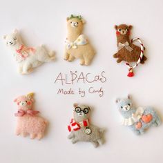 there are many different types of stuffed animals on the table with words that say, alpacas made by candy