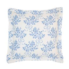 a blue and white pillow with flowers on it