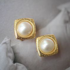 These stunning gold plated silver earrings feature a beautiful pair of hemisphere mabe pearl stones. With their intricate details and rich color, these push back studs are the perfect statement piece for any outfit. Handcrafted with care, these earrings are a true work of art and are sure to draw attention wherever you go. Whether you're looking for a unique gift or simply want to treat yourself. With their durable construction and timeless design, they're sure to become a beloved addition to yo Elegant Formal Clip-on Earrings, Gold Timeless Bridal Earrings For Wedding, Timeless Yellow Gold Bridal Earrings, Classic Gold Plated Round Clip-on Earrings, Classic Gold Plated Clip-on Earrings For Anniversary, Gold Plated Tarnish Resistant Clip-on Earrings For Anniversary, Classic Round Gold Plated Clip-on Earrings, Gold Clip-on Earrings For Anniversary, Gold Single Pearl Earring In Sterling Silver