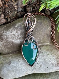 Green Onyx teardrop wrapped in oxidized copper wire to give it an antique look. Pendant is 3 inches tall and 1 inch tall. Comes with a free chain! Handmade Copper Wire Teardrop Pendant Jewelry, Unique Copper Wire Teardrop Pendant Jewelry, Teardrop Copper Wire Wrapped Jewelry, Handmade Teardrop Pendant Necklace In Copper Wire, Copper Teardrop Wire Wrapped Jewelry, Wire Wrapped Teardrop Copper Jewelry, Artisan Teardrop Copper Necklace, Unique Copper Teardrop Pendant Jewelry, Wire Wrapped Copper Wire Teardrop Pendant Necklace