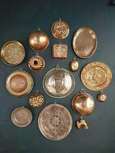 a collection of various gold and silver plates