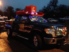 the truck is decorated with christmas lights and decorations