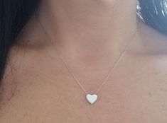 14K SOLID WHITE GOLD HEART NECKLACE Here is a dainty, delicate and simple, yet classy minimalist Heart Necklace.This is a 14k Solid White Gold open back heart necklace. (We do not sell filled or plated jewelry) Perfect for everyday use. Also available in 14k Yellow Gold. https://www.etsy.com/listing/749228903/14k-yellow-gold-heart-necklace?ref=listings_manager_grid Metal : 14K Solid Gold Necklace Length : 17 inches / 42.5cm Pendent Height : 9.10mm Pendant Width : 10.00mm Shipping Policy Item wil White Gold Heart Necklace, Yellow Gold Heart Necklace, Dainty Heart Necklace, Engraved Heart Necklace, Classy Minimalist, Tiny Heart Necklace, Mens Gold Wedding Band, Solid Gold Necklace, White Gold Wedding Bands