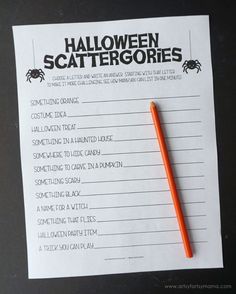 a halloween scatterer is sitting on top of a piece of paper with an orange pen