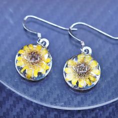 Vintage sterling silver 925 handmade earrings with resin sunflower inlay, stamped 925 Silver Resin Drop Earrings, Yellow Round Sunflower Jewelry, Handmade Sterling Silver Dangle Flower Earrings, Handmade Sterling Silver Flower Earrings, Elegant Silver Earrings With Pressed Flowers, Silver Round Resin Earrings, Sunflower Design Dangle Earrings As Gift, Sunflower Design Dangle Earrings For Gift, Nickel-free Silver Resin Jewelry