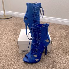 Never Worn Spring Blue Heels For Night Out, Blue Heels For Spring Night Out, Blue Heels For Night Out In Spring, Trendy Blue Heels With Wrapped Heel, Blue Lace-up Heels With Synthetic Material, Blue Lace-up Heels In Synthetic Material, Trendy Blue Closed Toe Heels, Blue Synthetic Lace-up Heels, Chic Blue Lace-up Heels