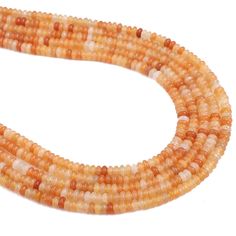 three strands of orange and white glass beads