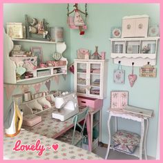 a sewing room with pink and white furniture