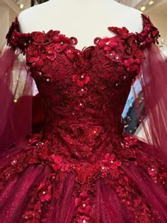 This stunning Quinceanera dress features a flattering off-the-shoulder neckline and exquisite 3D floral details. Made with high-quality tulle, it will make you look and feel like a princess on your special day. Elevate your style and make a statement with this gorgeous dress. Red Quinceanera Dresses Butterfly, Burgundy Quinceanera Dresses Long Sleeve, Red Quinceanera Dresses With Sleeves, Red Quinceanera Dresses With Cape, Red Xv Dresses, Burgundy Quince Dress, Burgundy Quince Dresses, Dark Red Quinceanera Dresses, Red Quinceanera Theme