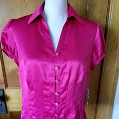 This Fuchsia Blouse Has Pleats In The Front So That You Can Wear It Tucked Out. It Has A Feel Like Silk, But Is Made With 100% Polyester. Pink Fitted V-neck Shirt, Pink Short Sleeve Blouse For Formal Occasions, Pink V-neck Blouse For Formal Occasions, Pink V-neck Top For Formal Occasions, Pink Fitted Formal Top, Formal Fitted Pink Blouse, Pink Fitted Short Sleeve Blouse, Fitted Pink Short Sleeve Blouse, Wear It