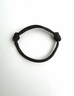 Rope bangle bracelet, Black paracord, 5mm Climbing rope, Minimalist gift, Simple Cord Bracelet, Mens stack Bracelet, Adjustable Bracelet This is a bracelet from 5mm paracord rope. - 100% handmade - Made out of real Paracord 4mm thick - One size fits all due to adjustable knots - The bracelet will wrap only once around your wrist. This bracelet is a great idea to extend your accessories to match as many outfits as possible!! Casual Outdoor Bracelet, Adjustable Black Braided Bracelet, Casual Black Braided Bracelets For Outdoor, Durable Nylon Cord Bracelets For Outdoor, Black Nylon Cord Braided Bracelet For Everyday, Everyday Black Braided Nylon Bracelets, Casual Black Durable Wristband, Adjustable Black Paracord Braided Bracelet, Adjustable Black Bracelets For Outdoor