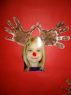 a child's hand and face are shown with their hands painted to look like clowns