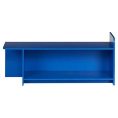 a blue shelf sitting on top of a white wall