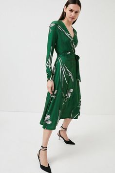 Stencilled With A Pencil-Drawn Floral Print, This Ethereal Midi Dress Is A Wearable Work Of Art. Its Slinky Jersey Fabric And Waist-Defining Tie Ensure It Flatters Any Figure - Add Strappy Stilettos To Dress It Up For Date Night. Elegant Green V-neck Floral Dress, Elegant Printed V-neck Midi Dress, Elegant Midi Dress With Floral Print, Green Printed Evening Dress, Midi Dress With Tie Waist, Spring Printed Knee-length Midi Dress, Spring Knee-length Printed Midi Dress, Printed Knee-length Midi Dress For Spring, Belted Midi Maxi Dress In Viscose