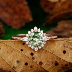 Engagement Ring Metal Type: 925 Sterling Silver, Soild 10k Gold, Solid 14k Gold, Solid 18k Gold Center Stone: natural moss agate Center Carat Weight: Round Cut 1.25CT (7mm) Side Stone: Moissanite Side Carat Weight: 0.4ctw Band Width: 1.35mm SKU: ESYFXR0392-moss agate Accessories: *Shipped with beautiful ring box; *Directly price from Manufacturer, 1/3 the price from Jewelry Store; - Ethically Sourced Luxury Tourmaline Jewelry With Prong Setting, Luxury Tourmaline Jewelry With Halo Setting, Elegant Tourmaline Jewelry With Halo Setting, Fine Jewelry Tourmaline Rings With Brilliant Cut, Luxury Tourmaline Wedding Jewelry, Fine Jewelry Tourmaline With Brilliant Cut, Round Tourmaline Jewelry With Halo Setting, Round Diamond Gemstones For Promise Ring, Emerald Cut Moissanite Jewelry With Halo Design