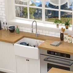 an image of a kitchen setting with sink, stove and countertop space in front of the window