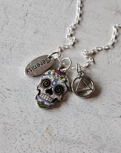 Fabulous petite silver AA symbol necklace. Unique design makes a great gift for your favorite person in recovery or a thoughtful gift for yourself (yes, you!) as a daily reminder you are living in the solution.  -20 inch sterling silver cable chain -Sugar skull charm -Serenity charm  -AA symbol charm -Nickel free -Celebrate sobriety (really, seriously, because you're a f%#king miracle) -Free shipping Aa Symbol, Aa Jewelry, Recovery Gifts, Symbol Necklace, Necklace Unique, Daily Reminder, Favorite Person, Cable Chain, Sugar Skull