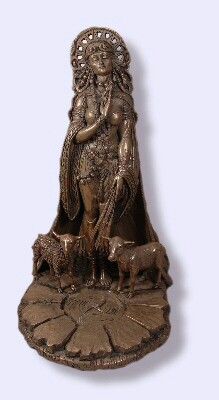 a bronze statue with a woman and two animals