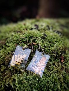 Beautiful Earrings made of genuine dry fern leaves and tiny forest flowers in a clear resin. Inspired by nature, fairytales, and forest. Magical and elegant earrings for nature lovers, bohemian and unique people. A perfect and unusual gift. Nature-inspired Dangle Earrings With Pressed Flowers, Nature-inspired Dangle Earrings, Handmade Leaf-shaped Nature-inspired Earrings, Handmade Leaf-shaped Botanical Earrings, Nature-inspired Green Earrings With Pressed Flowers, Handmade Botanical Leaf Earrings, Botanical Leaf-shaped Earrings With Ear Wire, Bohemian Drop Earrings With Natural Inclusions, Nature-inspired Drop Earrings With Natural Inclusions