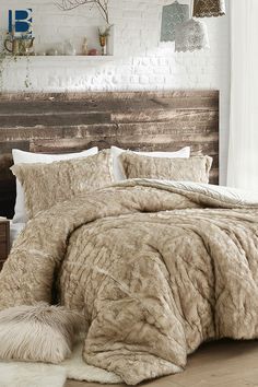 the bed is made up with fur and pillows