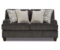 a gray couch with two pillows on it