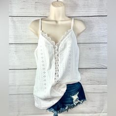 White Lace Eyelet Spaghetti Strap Tank Top Delicate Lace And Eyelet Detailing Create A Charming, Feminine Look On This Spaghetti Strap Tank Top. The Intricate Design Adds A Touch Of Elegance And Sophistication To Any Outfit. The Lightweight Material And Breathable Fabric Make It Perfect For Warm Weather Or Layering Under A Jacket. 95%Polyester 5%Elastane White Camisole With Adjustable Straps For Brunch, White Lace Camisole With Straps, White Camisole With Delicate Straps For Brunch, Spring White Camisole With Delicate Straps, Summer Lace Trim Spaghetti Strap Camisole, Lace Summer Tank Top, Summer Lace Tank Top With Straps, Summer Camisole With Lace Top And Spaghetti Straps, Lace Tank Top With Straps For Summer