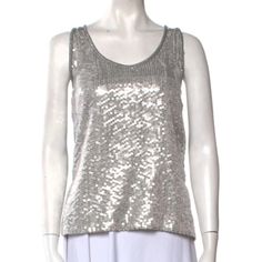 Dvf Sleeveless Sequin Top. Silver Sequined Front, Black Back, High Low Hem. Glittering Sequins Highlight This Elongated Silhouette Of Finely-Woven Silk. New With Tag Attached! Brand/Maker - Diane Von Furstenberg Style - Scoop Neck Sleeveless Top Name - Desta Size On Tag - 8 Shoulder - N/A Sleeve (Shoulder To Cuff) - N/A Sleeve (Underarm To Cuff) - N/A Chest (Pit-To-Pit) - 17.5“ Waist - 18.5“ Length - 24“ Color - Black/Silver Material - 100% Polyester. Condition - Mint Nwt Condition; No Flaws Mad Chic Silver Sleeveless Top, Glamorous Silver Sleeveless Tops, Silver Sleeveless Top For Evening, Silver Sleeveless Top For Night Out, Chic Fitted Silver Tank Top, Silver Tank Top For Party, Silver Sequined Tank Top, Silver Fitted Tank Top, Elegant Metallic Tank Top For Summer