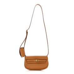 This is an authentic HERMES Swift Kelly Moove in Etoupe.This stylish shoulder bag is crafted of swift leather in dark beige. The bag features a lengthy crossbody strap with a coin purse attached and polished gold hardware. The gold turn lock opens to a matching interior with a pocket. Hermes Crossbody Bag, Stylish Shoulder Bag, Dark Beige, Hermes Bags, Crossbody Strap, Tri Color, Gold Hardware, Swift, Coin Purse