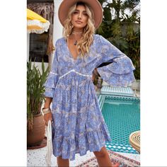 Boho Beautiful Blue Purple Color V Neck Mini Dress. Features A 3/4 Sleeve And Ruffles At Bottom. S 2/4 M 6/8 L 10/12 Xl 14 Summer Dress With Ruffle Hem And 3/4 Sleeves, Summer Dresses With Ruffle Hem And 3/4 Sleeves, 3/4 Sleeve Ruffled Dress For Day Out, Ruffled Dresses With 3/4 Sleeves For Day Out, 3/4 Sleeve Dresses With Ruffles For Day Out, Beach Boho Dress With 3/4 Sleeves, Day Out Dresses With Ruffles And 3/4 Sleeve, Light Blue Summer Dress With 3/4 Sleeves, Blue Dresses With 3/4 Sleeves For Vacation