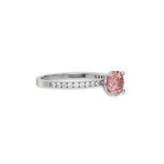 This ring is made with a fancy Pink round solitaire diamond set in four-prong setting, and is complemented by a round pave diamonds band.Details: - Made to Order- Focal Diamond Weight: 1.00 CT, 1.25 CT, 1.50 CT, 1.75 CT, 2.00 CT, 2.50 CT, 3.00 CT- Accent Diamond Weight: 0.22 CT - No Of Diamonds: 19- Diamond Type: Lab Grown Diamond (CVD, HPHT)- Diamond Cut: Round- Diamond Clarity: VS - Focal Diamond Color: Fancy Pink- Accent Diamond Color: Colorless (DEF)- Setting Type: Prong and Pave- Band Thick Classic Pink Diamond Ring With Accents, Promise Diamond Ring With Side Stones In Cubic Zirconia, Cubic Zirconia Diamond Ring With Side Stones For Promise, Promise Rings With Side Stones In Cubic Zirconia, Pink Diamond Rings With Pave Setting, Diamond Promise Ring With Pave Setting, Diamond Ring With Pave Setting For Promise, Promise Ring With Pave Setting In Round Band, Pink Pave Set Round Cut Ring