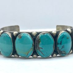 Navajo Kingman Turquoise Bracelet With Six Oval Cabochon Surrounded By Bead Drop Border. Turquoise Is Stunning Lighter Blue Color Of Excellent Quality. Period: After 1950 Origin: Navajo, Southwest Size: 7", 1 3/4" Opening, 1 1/4"H, 2.75" X 2" Signed By Pj Acsit Kingman Mine, Turquoise, Sterling Silver, Bracelets, Navajo (1 Inch = 25.4 Mm; 1 Dime = 17.9mm). All Items Are Pre-Owned Unless Otherwise Stated. This Means They Have The Usual Aspects Of Pre-Owned Jewelry, Such As Light Scratches, Wear And Tarnish. Please Review All The Photos Which Will Be Part Of The Description. Turquoise Cuff, Kingman Turquoise, Mens Accessories Jewelry, Light Blue Color, Cuff Bangles, Oval Cabochon, Turquoise Sterling Silver, Silver Bracelets, Sterling Silver Bracelets