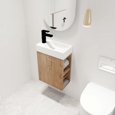 a bathroom with a toilet, sink and mirror in it's corner area on the wall