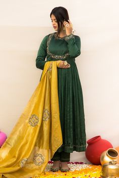 Green silk chanderi anarkali with zardosi hand embroidered neckline, yoke and cuffs. Comes with pant and a kota tissue dupatta.
Components: 3
Pattern: Hand embroidered
Type Of Work: Zardosi
Neckline: Round
Sleeve Type: Full
Fabric: Silk chanderi, Dupatta : Kota tissue, Lining : Mulmul
Color: Green
Other Details: 
Embroidered dupatta
Closure : Back button
Disclaimer : The natural imperfection and textures in the weaves are the outcome of handloom fabrics (not to be considered as defect)
Occasion: Designer Slub Silk Salwar Kameez With Dabka, Unstitched Chanderi Gown With Dabka, Green Anarkali Set With Dori Work, Festive Tussar Silk Anarkali Set With Dabka Work, Designer Anarkali Tussar Silk Sharara, Dabka Embroidered Raw Silk Gown For Diwali, Anarkali Tussar Silk Sharara For Designer Wear, Raw Silk Dabka Gown For Diwali, Diwali Raw Silk Gown With Dabka