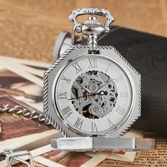 The Steampunk look is sophisticated and elegant. You won't miss it with this Roman pocket watch. Introducing our Roman Steampunk Pocket Watch - an exquisite vintage accessory with Roman numeral dial. Comes with a matching chain and elegant presentation box. Perfect for Steampunk enthusiasts or as a thoughtful gift. Order now and make a timeless statement of style! Features: Movement: hand-wound mechanical Case materials: Stainless steel Dial diameter: 1.9inch Chain length: 11.8inches | 30cm Steampunk Pocket Watch, Luxury Storage, Mechanical Pocket Watch, Mechanical Hand, Fob Watch, Hiking Bag, Mechanical Movement, Roman Numerals, Mechanical Watch