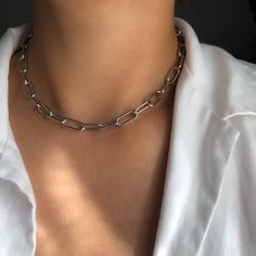 ♡ LUXX ♡ * Stunning stainless steel chain (silver) * Perfect for layering * Luxurious design * Water resistant * Total chain length: 45 cm * Adjustable * Super shiny ➪  𝐴𝑙𝑙 𝑃𝑟𝑜𝑑𝑢𝑐𝑡𝑠 𝑎𝑟𝑒 𝑐𝑎𝑟𝑒𝑓𝑢𝑙𝑙𝑦 𝑝𝑎𝑐𝑘𝑎𝑔𝑒𝑑 𝑤𝑖𝑡ℎ 𝑙𝑜𝑣𝑒.  ➪  𝑃𝑎𝑐𝑘𝑎𝑔𝑒 𝑖𝑛𝑐𝑙𝑢𝑑𝑒𝑠: 𝐼𝑡𝑒𝑚 (𝑜𝑓 𝑐𝑜𝑢𝑟𝑠𝑒), 𝑎 𝑙𝑜𝑣𝑒𝑙𝑦 𝑉𝑒𝑙𝑣𝑒𝑡 𝐺𝑖𝑓𝑡 𝑏𝑎𝑔. ✲ 𝑇ℎ𝑒 𝑟𝑒𝑐𝑜𝑚𝑚𝑒𝑛𝑑𝑒𝑑 𝑐ℎ𝑎𝑖𝑛 𝑠𝑖𝑧𝑒 𝑓𝑜𝑟 𝑡ℎ𝑖𝑠 𝑖𝑡𝑒𝑚 𝑖𝑠 40 𝑐𝑚. ♡  𝐼𝑓 𝑦𝑜𝑢 𝑎𝑟𝑒 ℎ𝑎𝑣𝑖𝑛𝑔 𝑠𝑜𝑚𝑒 𝑠 Luxury Link Cable Chain Necklaces, Modern Silver Clavicle Chain Necklace, Trendy Silver Box Chain Necklace, Silver Metal Cable Chain Necklace, Silver Metal Chain Necklace With Rectangular Links, Silver Minimalist Chunky Chain Necklace, Silver Stainless Steel Paperclip Chain Necklace, Steel Gifts, Chic Bracelet