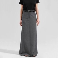 Discover Timeless Elegance Step into a world of sophistication with our Elegant High Waist Gray Long Skirt, a perfect blend of style and comfort for the modern woman. Designed for the autumn and winter seasons, this skirt is a staple for those who appreciate a touch of class in their wardrobe. Its ankle-length design, combined with a tasteful side slit, offers a perfect balance of modesty and allure, making it ideal for both office and social settings. Exceptional Design and Quality Every detail of this skirt speaks of quality and style. The empire waistline elegantly cinches at the narrowest point, creating a flattering silhouette for all body types. The woven fabric, a luxurious mix of cotton and polyester, promises both durability and comfort. This skirt's solid color and straight silho Gray Long Skirt, Corp Core, High Waist Long Skirt, Empire Waistline, Polished Look, Autumn And Winter, Piece Of Clothing, Long Skirt, Modern Woman