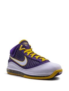 the nike zoom basketball shoe in purple and yellow