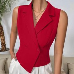 Elevate Your Wardrobe With The Striking Red Double-Breasted Sleeveless Blazer, A Perfect Blend Of Sophistication And Modern Elegance. This Vest-Style Blazer Showcases A Stunning Asymmetrical Hem And A Classic Lapel Neckline, Making It A Standout Piece For Any Occasion. The Double-Button Closure Adds A Touch Of Refined Detail, While The Vibrant Red Color Ensures You Make A Bold Statement. Crafted From High-Quality Woven Fabric, This Blazer Features A Regular Fit That Exudes Confidence And Style. Red V-neck Vest For Spring, Red Sleeveless Formal Tops, Formal Red Sleeveless Top, Fitted Red Vest For Summer, Red Fitted Vest For Summer, Fitted Sleeveless Office Vest, Elegant Fitted Red Vest, Elegant Red V-neck Tank Top, Sleeveless Summer Office Vest