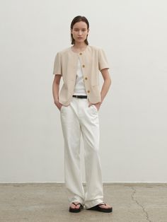 Casual and minimal jacket that has stretchy and lightweight texture. Featuring the basic rounded neckline, welt pockets, and the wood buttons detail. The oblique seam lines at front and back creates slim silhouette. Style with t-shirts and denim jeans to complete the daily looks. - Rounded neckline and half-sleeved design- Oblique seam lines at front and back- Welt pockets at front- Four-button closure at front- Loose silhouette and standard length Cotton Crew Neck Outerwear For Work, Spring Crew Neck Workwear Outerwear, Spring Crew Neck Outerwear For Work, Casual Tailored Single Breasted Top, Casual Tailored Single-breasted Top, Casual Single-breasted Tailored Top, Casual Short Sleeve Blazer For Work, Tailored Beige Tops For Work, Casual Short Sleeve Blazer With Button Closure